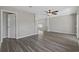Bright and airy living room featuring vinyl floors, a ceiling fan, and fresh paint at 6454 Sweet Gum Trail, Myrtle Beach, SC 29588