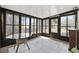 Sunroom with windows, tile floors, and a glass-topped table at 6454 Sweet Gum Trail, Myrtle Beach, SC 29588