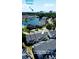 Aerial view of townhomes near the Atlantic Ocean, featuring a lake and manicured lawns at 703 S 1St Ave. S # 34D, North Myrtle Beach, SC 29582