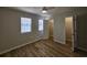 Spacious bedroom with ceiling fan, two windows, and access to closet space at 703 S 1St Ave. S # 34D, North Myrtle Beach, SC 29582