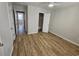 Bedroom with new wood-look vinyl flooring at 703 S 1St Ave. S # 34D, North Myrtle Beach, SC 29582