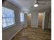 Light-filled bedroom with ceiling fan, wood floors, and closet space at 703 S 1St Ave. S # 34D, North Myrtle Beach, SC 29582