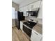 Sleek kitchen features stainless steel appliances, granite countertops, and ample white cabinetry for a modern aesthetic at 703 S 1St Ave. S # 34D, North Myrtle Beach, SC 29582