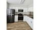 Well-equipped kitchen with stainless steel appliances, granite countertops, and white cabinets provides a modern and functional space at 703 S 1St Ave. S # 34D, North Myrtle Beach, SC 29582