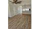 Open-concept living area with wood-look flooring, flowing seamlessly into the kitchen, creates an inviting atmosphere at 703 S 1St Ave. S # 34D, North Myrtle Beach, SC 29582