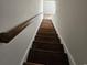 View of a modern wooden staircase with hand railing leading to the next level at 703 S 1St Ave. S # 34D, North Myrtle Beach, SC 29582