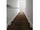 View of a modern wooden staircase with hand railing leading to the next level at 703 S 1St Ave. S # 34D, North Myrtle Beach, SC 29582