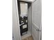 Air conditioning unit in a utility closet with white doors and tile floor at 703 S 1St Ave. S # 34D, North Myrtle Beach, SC 29582