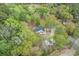 Aerial view showcasing the home nestled within a lush, green landscape at 1047 Holt Rd., Conway, SC 29526