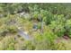 An aerial view of the home showcasing its location on a tree-lined street at 1047 Holt Rd., Conway, SC 29526