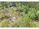 An aerial view of the home showcasing its location on a tree-lined street at 1047 Holt Rd., Conway, SC 29526