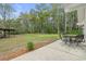 Expansive backyard featuring a covered patio area and a shed, perfect for outdoor entertaining and storage at 1047 Holt Rd., Conway, SC 29526