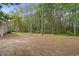 Large private backyard with mature trees, offering plenty of space for recreation and relaxation at 1047 Holt Rd., Conway, SC 29526