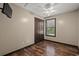 Bedroom featuring wood floors, ceiling fan, closet, and television at 1047 Holt Rd., Conway, SC 29526