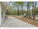 Side view of the home with a concrete patio and view of the yard at 1047 Holt Rd., Conway, SC 29526