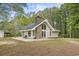 Home featuring stone accents, a stone chimney and a quaint backyard at 1047 Holt Rd., Conway, SC 29526