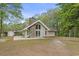 Charming home with stone chimney, large windows, and wooded surroundings at 1047 Holt Rd., Conway, SC 29526
