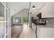Open concept kitchen with white cabinets and stainless steel appliances at 1047 Holt Rd., Conway, SC 29526