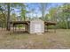 Outdoor shed featuring sheltered storage, ideal for gardening tools or equipment, set in a yard at 1047 Holt Rd., Conway, SC 29526