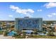 Wide aerial shot of beachfront hotel featuring multiple pools and balcony views at 1105 Coral Beach Circle # 438, Myrtle Beach, SC 29577