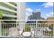 Outdoor balcony with white chairs and a small table with a view at 1105 Coral Beach Circle # 438, Myrtle Beach, SC 29577