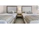 Hotel bedroom with beds, table and lamp at 1105 Coral Beach Circle # 438, Myrtle Beach, SC 29577