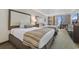 Hotel bedroom with TV and balcony at 1105 Coral Beach Circle # 438, Myrtle Beach, SC 29577