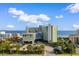 Beautiful aerial view of a modern beachfront hotel with lush landscaping and ample parking at 1105 Coral Beach Circle # 438, Myrtle Beach, SC 29577