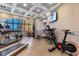 Well-equipped gym with treadmills, stationary bikes, free weights, and a large TV at 1105 Coral Beach Circle # 438, Myrtle Beach, SC 29577