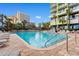 Large outdoor pool surrounded by lounge chairs and palm trees, providing a perfect spot for relaxation and recreation at 1105 Coral Beach Circle # 438, Myrtle Beach, SC 29577