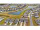 Aerial view of a residential community with a lake, manicured lawns, and well-maintained homes at 1210 Harbison Circle, Myrtle Beach, SC 29579