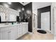 Bathroom showcasing a dual sink vanity with a large mirror and a walk-in shower at 1210 Harbison Circle, Myrtle Beach, SC 29579