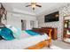 This bedroom has wallpapered accent wall, ceiling fan, and a decorative dresser and mirror at 1210 Harbison Circle, Myrtle Beach, SC 29579
