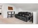 Bonus room features vaulted ceilings, a black leather couch, and a table with chairs at 1210 Harbison Circle, Myrtle Beach, SC 29579