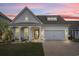 Well-lit single-Gathering home exterior with a manicured lawn against a beautiful sunset backdrop at 1210 Harbison Circle, Myrtle Beach, SC 29579