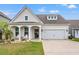 Beautiful single-Gathering home with a manicured lawn and charming curb appeal on a sunny day at 1210 Harbison Circle, Myrtle Beach, SC 29579