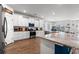 Bright, open kitchen with stainless steel appliances, white cabinets, and a large island for entertaining at 1210 Harbison Circle, Myrtle Beach, SC 29579