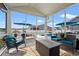 Covered patio featuring comfortable seating, an outdoor fire pit, and a view of the pool at 1210 Harbison Circle, Myrtle Beach, SC 29579