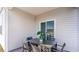 This outdoor patio features neutral siding and a sliding door, creating a relaxing retreat for outdoor enjoyment at 1451 Nokota Dr., Conway, SC 29526