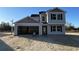 Two-story home featuring light gray siding, a two-car garage, and dark shutters at 1494 Hardwick Rd., Conway, SC 29526
