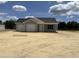 Charming single-story home with a two-car garage, light blue siding, and a well-manicured lawn at 1502 Hardwick Rd., Conway, SC 29526
