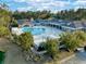 Beautiful aerial view of community pool surrounded by patio and lush landscaping at 1652 Murrell Pl., Murrells Inlet, SC 29576