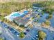 Stunning aerial view of community pool, clubhouse, tennis courts, and parking at 1652 Murrell Pl., Murrells Inlet, SC 29576