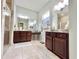 Lovely bathroom features double vanities with granite countertops, large mirrors, and a separate shower area at 1652 Murrell Pl., Murrells Inlet, SC 29576