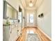 Bright and inviting foyer with hardwood floors, decorative mirror, and stylish accents at 1652 Murrell Pl., Murrells Inlet, SC 29576