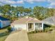 Charming single-story home featuring a well-manicured lawn, attached two car garage, and a cozy front porch at 1652 Murrell Pl., Murrells Inlet, SC 29576