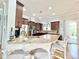 This kitchen features granite countertops, a large island with seating, and stainless steel appliances at 1652 Murrell Pl., Murrells Inlet, SC 29576