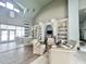 Cozy lounge area with comfortable chairs, bookshelves, and natural light at 1652 Murrell Pl., Murrells Inlet, SC 29576
