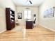 This office features hardwood floors, a ceiling fan, a desk, and a bookshelf at 1652 Murrell Pl., Murrells Inlet, SC 29576