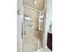Modern shower features glass enclosure, tiled walls, and a rainfall showerhead for a spa-like experience at 1652 Murrell Pl., Murrells Inlet, SC 29576